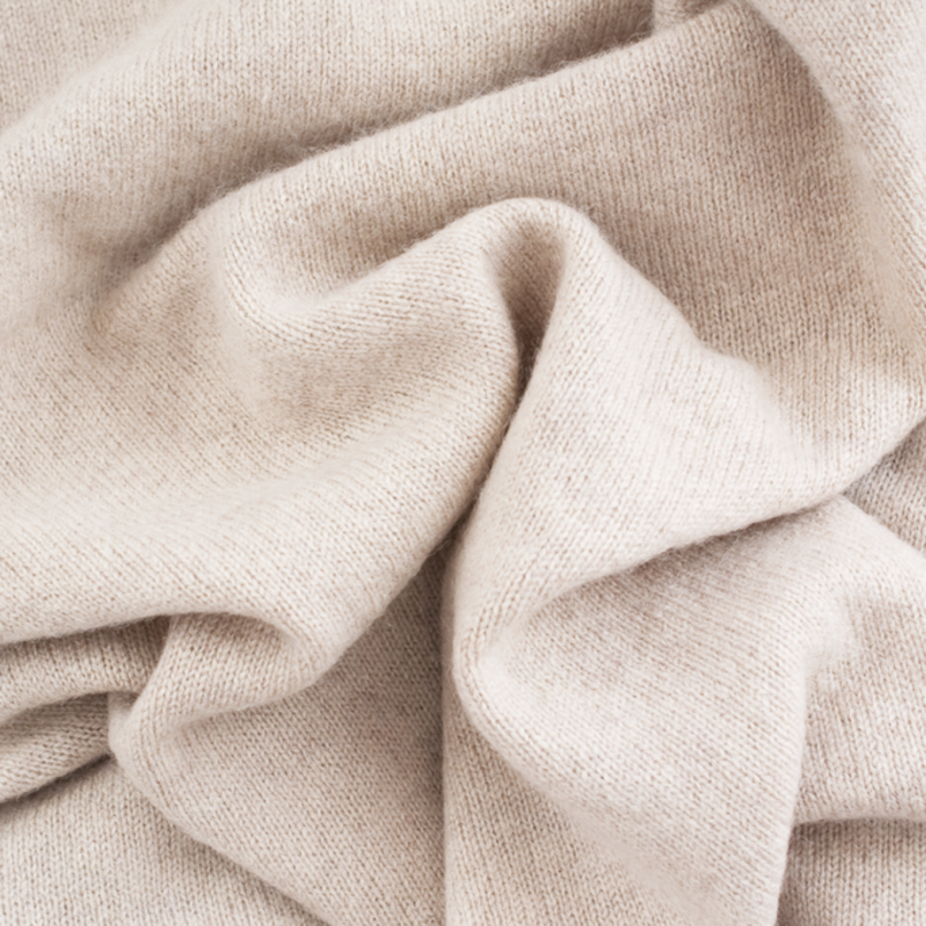 Close-up of beige fabric with folds