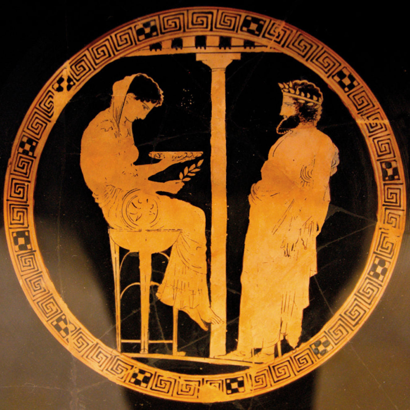 Ancient Greek vase with two figures in a decorative frame