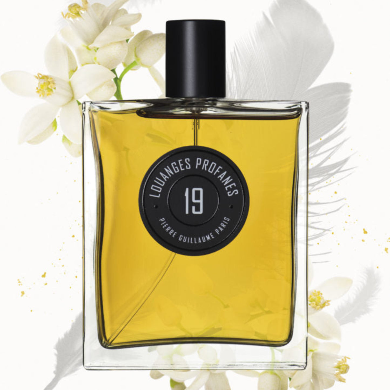 Perfume bottle with flowers on a white background
